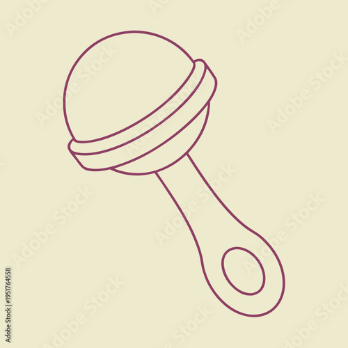 Maroon baby rattle on beige background