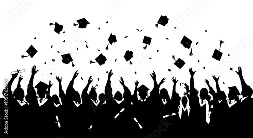 Graduates celebrate tossing caps in air.