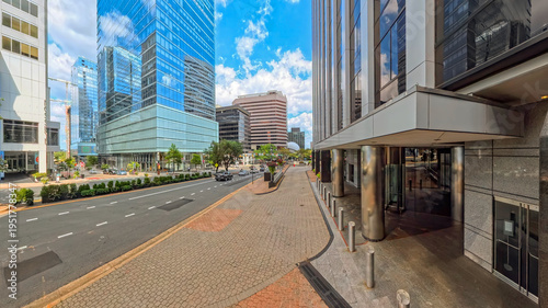 Wide city street intersection with modern office towers Rosslyn Arlington Virginia USA