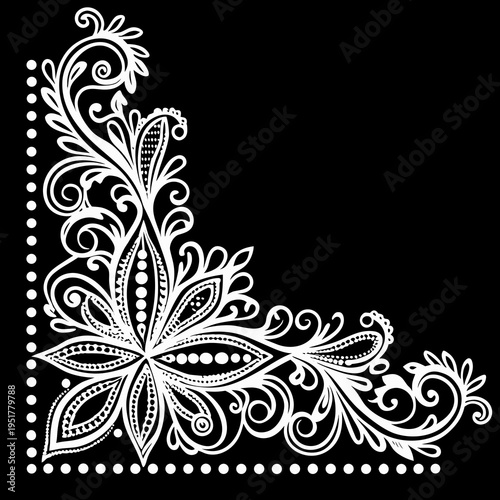 Intricate white floral corner design on a solid black background