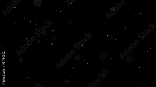 Soft white dust particles and subtle bokeh lights floating slowly against a dark abstract background motion