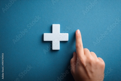 Choosing Positivity: A single finger points towards a bright, three-dimensional plus sign, symbolizing a positive mindset and optimism against a contrasting background.
