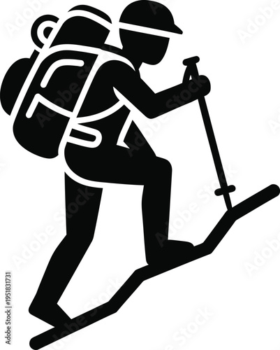 Silhouette of a skier with a backpack and ski poles