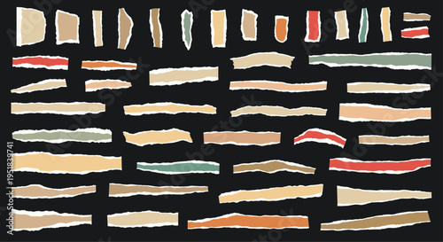 Large collection of torn paper strips in different shapes and muted colors like beige, red, and green is scattered on a black surface.