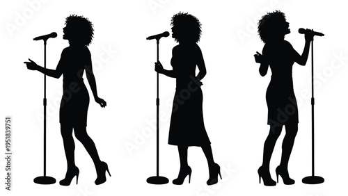 Three women singing into microphones on stage