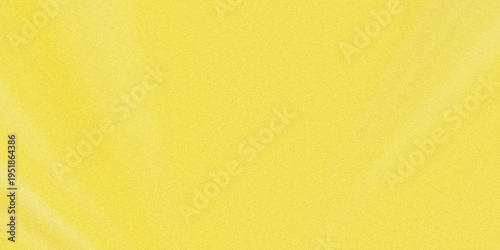 Soft gradient of warm yellow hue on a smooth, textured fabric surface
