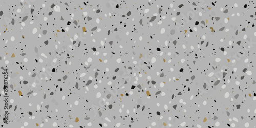 Gray terrazzo pattern with scattered white black and gold speckles