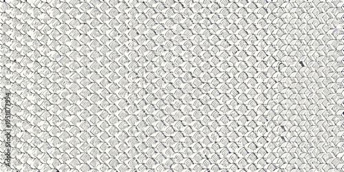 Close up of woven straw texture with repeating curved patterns