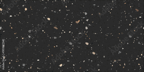 Dark speckled texture with scattered fragments of varying tones