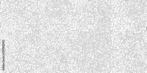 Close up of cracked white surface resembling a mosaic or aged texture