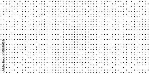 Dense arrangement of small black dots on a clean white background