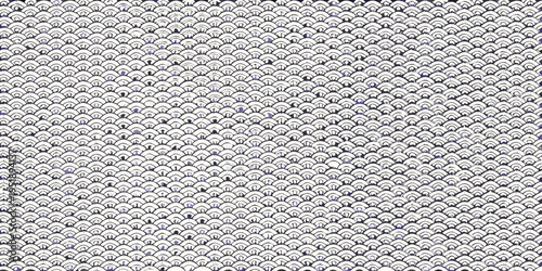 Intricate pattern of overlapping stylized wave shapes in shades of blue