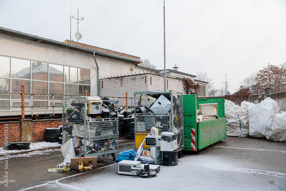 Naklejka premium Electronic Waste Recycling Yard With Dumpsters, Old Appliances And Scrapped Electronics