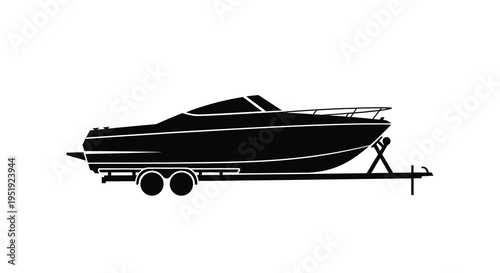A sleek black silhouette of a powerboat resting on a trailer showcasing its streamlined design and nautical form