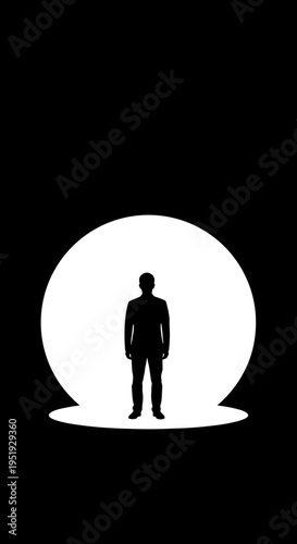 Silhouette of a standing man.