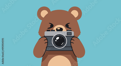 Brown bear holding a camera.