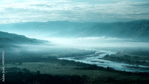 Serene River Valley at Dawn with Misty Mountains