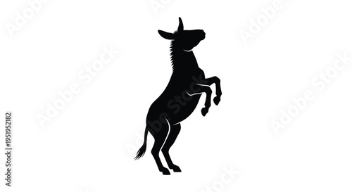 A rearing donkey depicted in a striking black silhouette