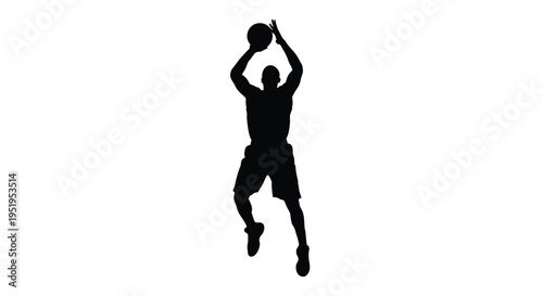 A basketball player in mid air shooting a dramatic silhouette