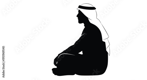 Seated arab man in traditional dress a striking black silhouette
