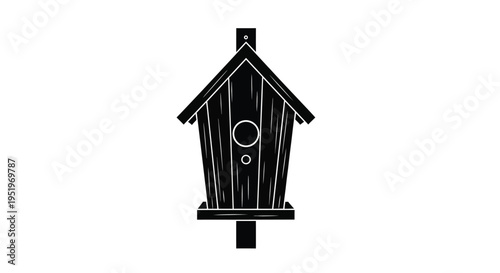 Black birdhouse design with a circular entrance a striking silhouette