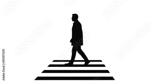 A man walking across a crosswalk depicted in stark silhouette