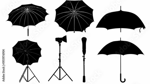 Six black umbrellas and two light stands are silhouetted against a stark white backdrop