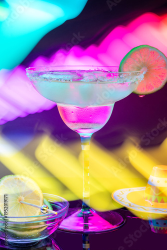 Classic margarita isolated with lime and salt rim with dramatic light painting background