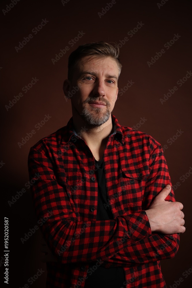 Obraz premium Brutal man with beard on dark background