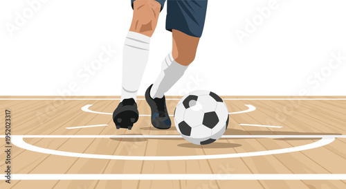 A soccer player's legs and feet are dribbling a black and white soccer ball on a wooden court with white markings.