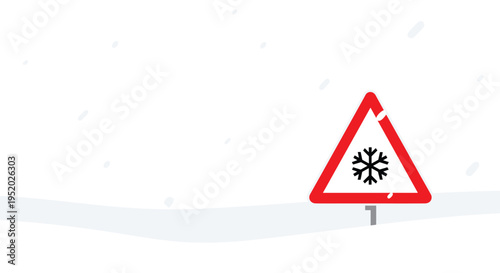 A red triangular warning sign with a black snowflake symbol is placed on snowy ground with falling snowflakes.