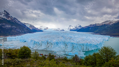 a wide angle view of perito moreno glacier on a cloudy autumn day in los glaciares national park of argentina
