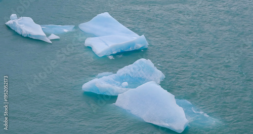 a high angle shot of several white icebergs at perito moreno glacier in los glaciares national park of argentina