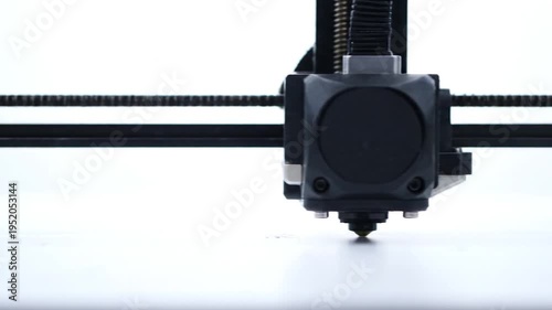 Close Up View Of 3D Printer Extruder On Print Bed In Action.