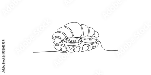 Continuous line drawing of a croissant with melted chocolate on top pastry