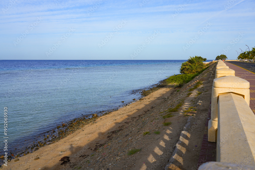 Obraz premium Peaceful waterfront promenade overlooking the Red Sea in Umluj, Saudi Arabia