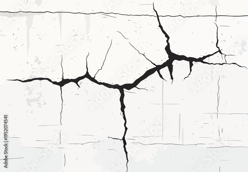 Cracked white wall with black lines showing damage and wear over time