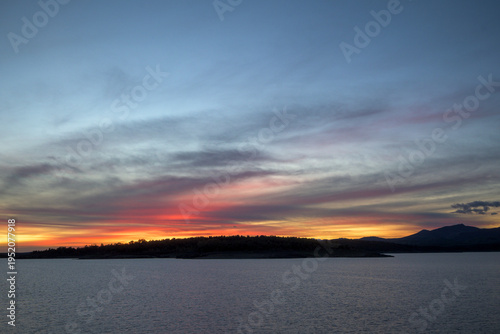 Wallpaper Mural Sunset over lake and mountain silhouettes Torontodigital.ca