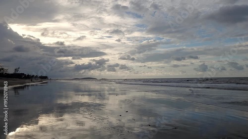 Golden hour dramatic sky at paradisiacal serene Prea beach in Ceara, Brazil.