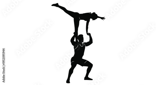 Acrobats perform a challenging balancing act in a dynamic silhouette pose.