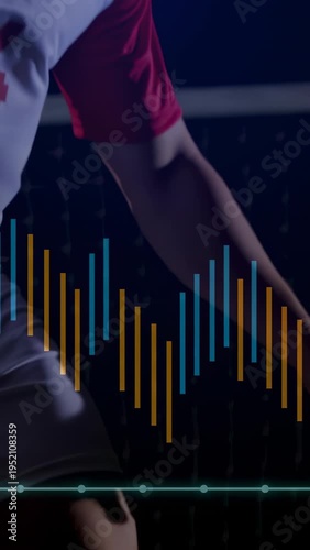 Vertical video: Soccer player flicking ball from cleat to chest, balancing on night pitch with bars