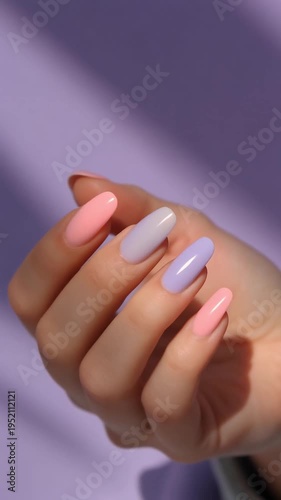 Close-up Video of Hand with Soft Pastel Nail Art Featuring Pink and Lavender Tones