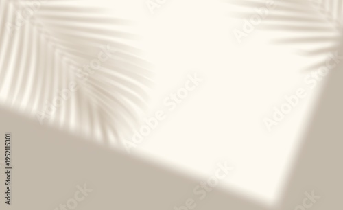 Minimalist Blurred background with strong palm leaf shadow pattern on a light wall 