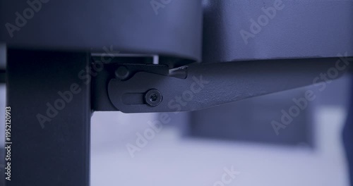 Person lifting and lowering grill panel - extreme closeup