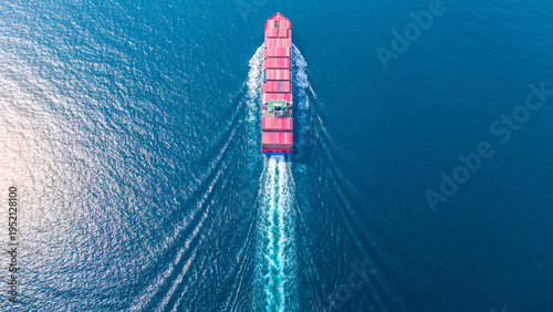 Bilde på lerret massive container ship loaded with colorful cargo navigating the ocean near a commercial port terminal