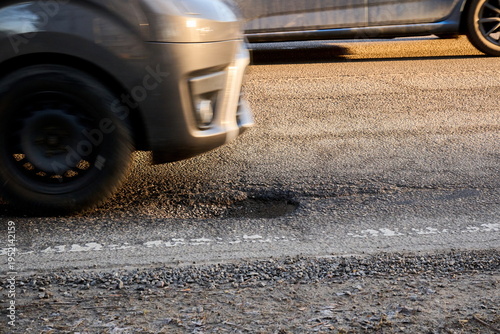 Εκτύπωση καμβά Car Driving Past a Dangerous Pothole on a Damaged Asphalt Road
