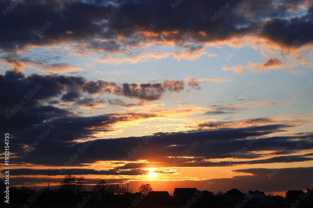 Fototapeta premium Summer sunset over the village. Summer or autumn evening.