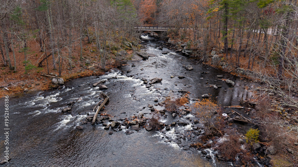Fototapeta premium Fall aerial view featuring Packers Falls in Durham, New Hampshire