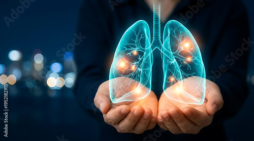 A person holds glowing lungs with inflamed areas in their cupped hands against a dark background with blurred city lights