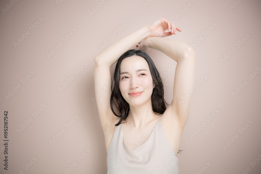 Fototapeta premium Image of beauty and spa treatments for young women, such as underarm hair removal, on a pink-beige background